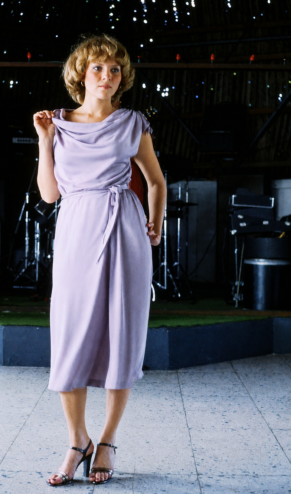 Restored ArtCenter fashion photograph of a woman modeling a lavender dress