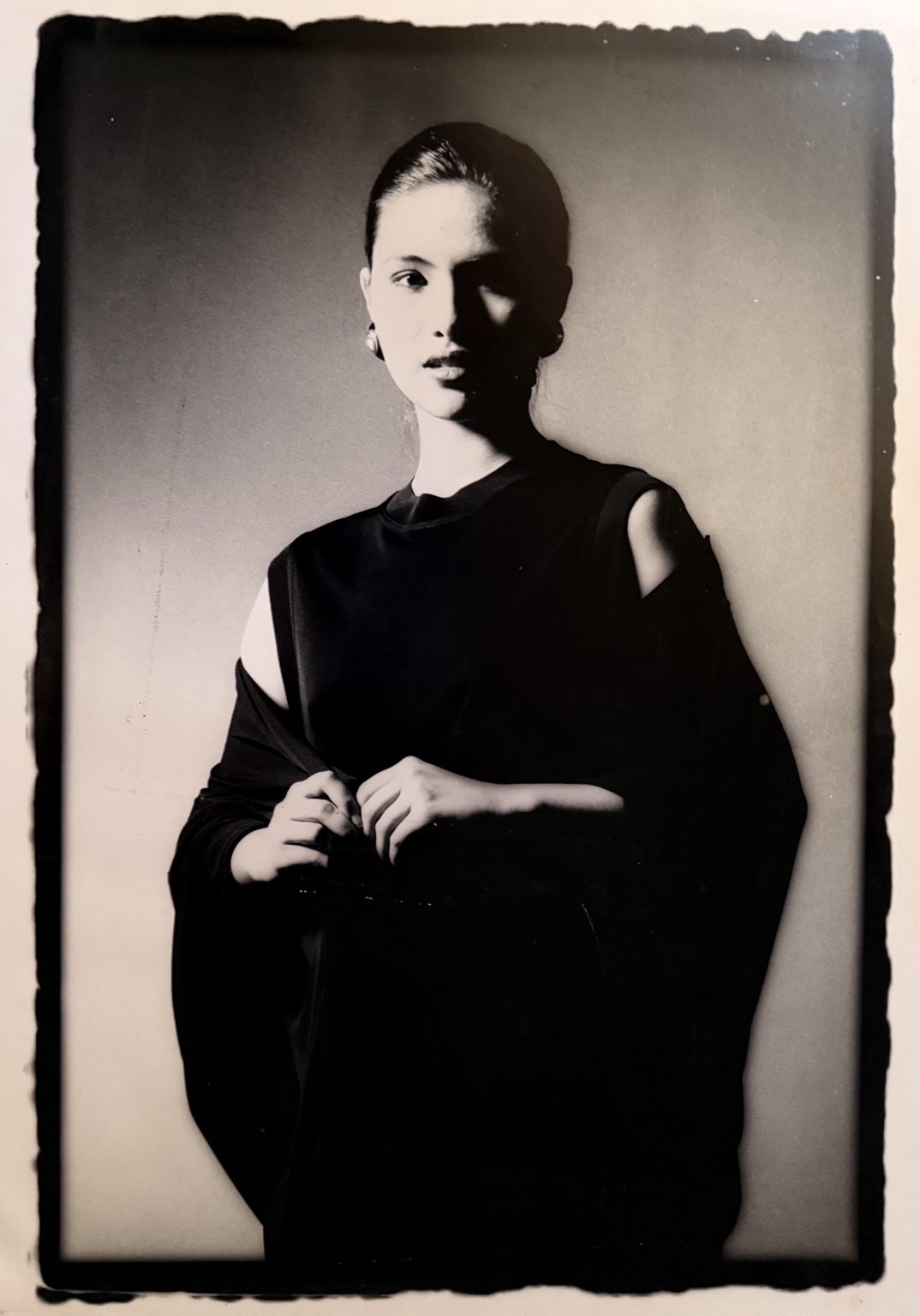 Monochrome ArtCenter fashion portrait of a woman in a dark sleeveless dress