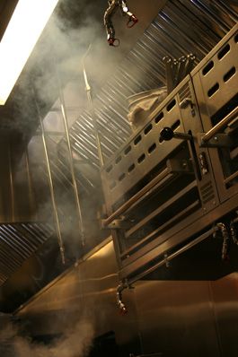 Working commercial kitchen photographed in warm light