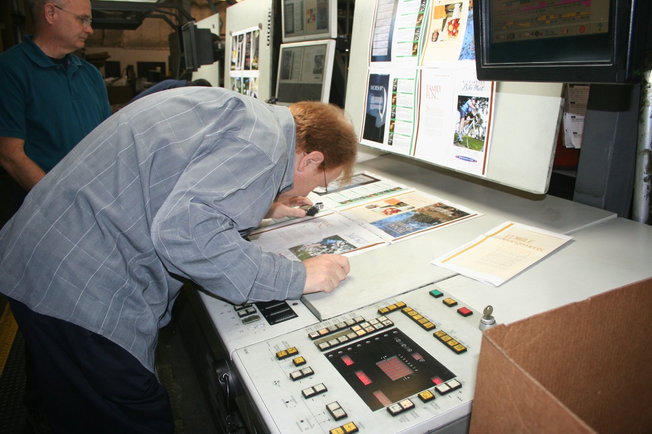 Bob Saint John checking press proofs